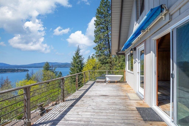 deck featuring a water and mountain view