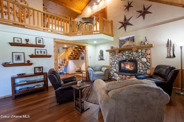 2264 Parker Canyon Rd, Bonners Ferry, ID 83805 - living area with wood finished floors, a fireplace, high vaulted ceiling, stairway, and wooden ceiling