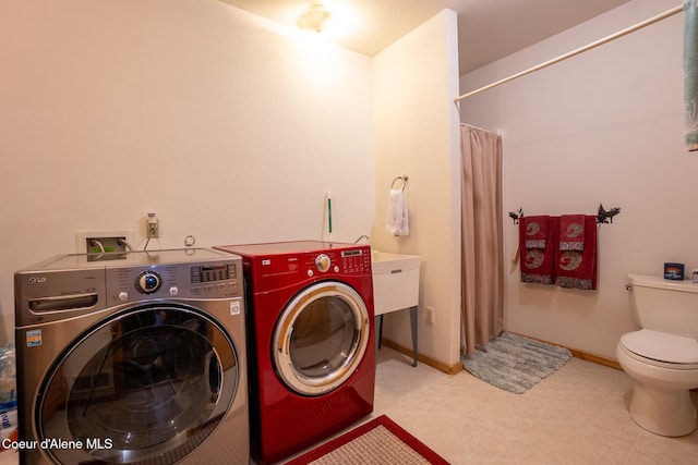 2264 Parker Canyon Rd, Bonners Ferry, ID 83805 - washroom with baseboards, laundry area, and washer and clothes dryer