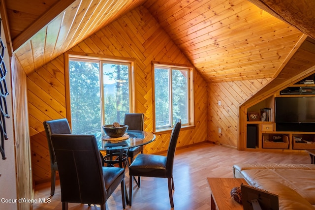 2264 Parker Canyon Rd, Bonners Ferry, ID 83805 - dining space featuring wooden walls, wood finished floors, and lofted ceiling