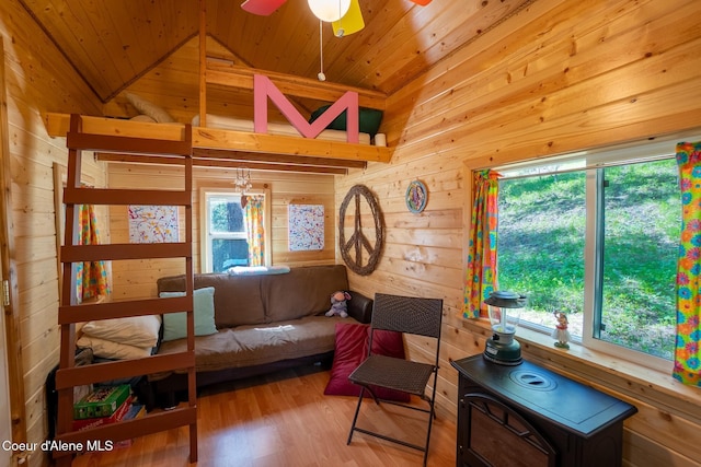 2264 Parker Canyon Rd, Bonners Ferry, ID 83805 - living room with wooden walls, a ceiling fan, wooden ceiling, and lofted ceiling