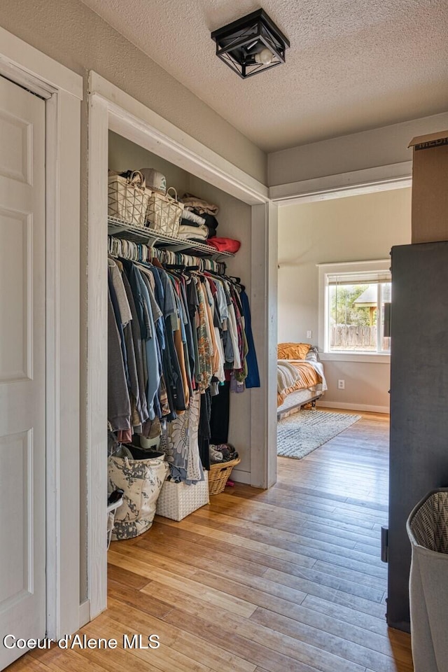 spacious closet with wood finished floors