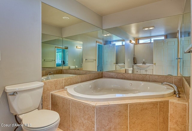 full bath with a garden tub, toilet, and vanity