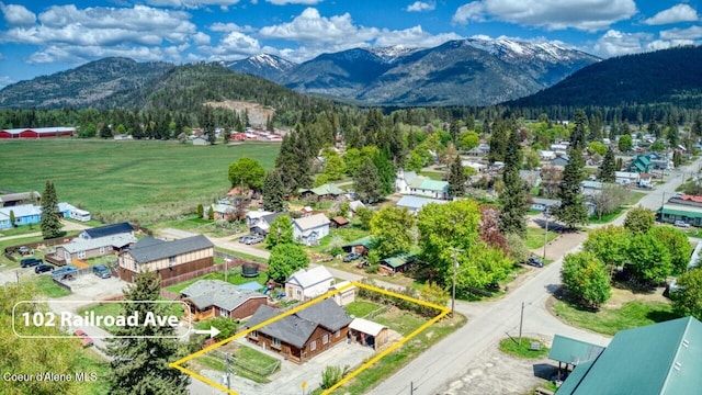 aerial view of residential area with mountains and property parcel outlined