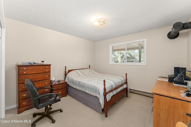 2450 N Ridgeview Dr, Post Falls, ID 83854 - bedroom featuring a baseboard radiator, a desk, light carpet, and a textured ceiling