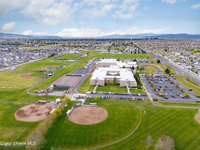 2450 N Ridgeview Dr, Post Falls, ID 83854 - aerial view of property and surrounding area with a mountain backdrop and nearby suburban area