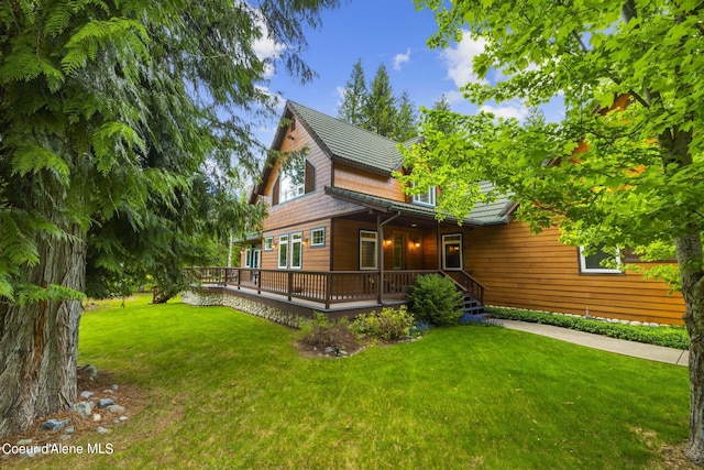 1201 Paradise Valley Rd, Bonners Ferry, ID 83805 - back of property featuring a yard and a wooden deck