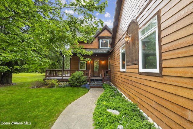 1201 Paradise Valley Rd, Bonners Ferry, ID 83805 - doorway to property with a lawn and a porch