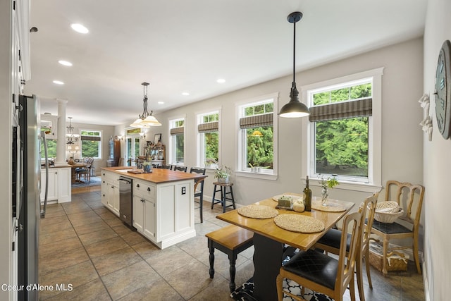 1201 Paradise Valley Rd, Bonners Ferry, ID 83805 - kitchen with butcher block countertops, appliances with stainless steel finishes, white cabinetry, recessed lighting, and decorative light fixtures
