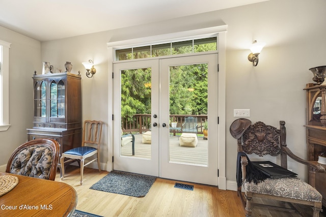 1201 Paradise Valley Rd, Bonners Ferry, ID 83805 - doorway to outside with wood finished floors and baseboards