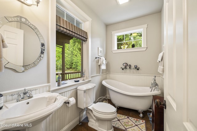 1201 Paradise Valley Rd, Bonners Ferry, ID 83805 - full bath with a sink, wainscoting, a freestanding tub, and toilet