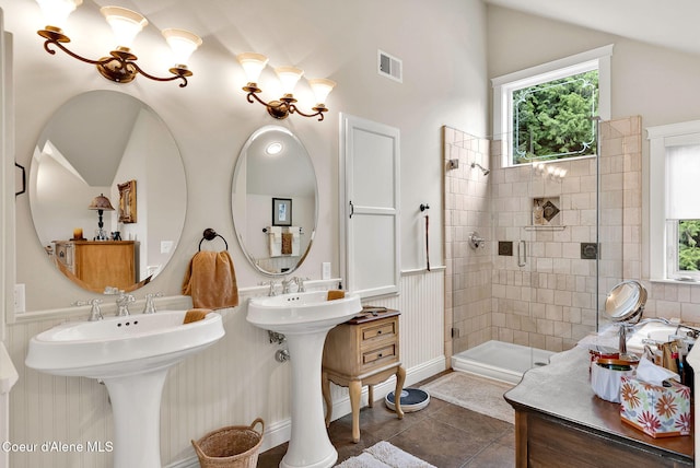 1201 Paradise Valley Rd, Bonners Ferry, ID 83805 - bathroom featuring healthy amount of natural light, a stall shower, lofted ceiling, and tile patterned flooring