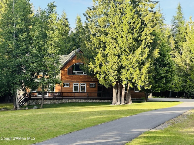 1201 Paradise Valley Rd, Bonners Ferry, ID 83805 - view of front of house featuring a front lawn and a deck