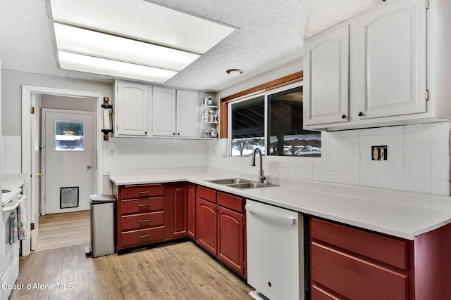 19856 B St Joe River Rd, Calder, ID 83808 - kitchen with a sink, light countertops, white appliances, and light wood-style flooring