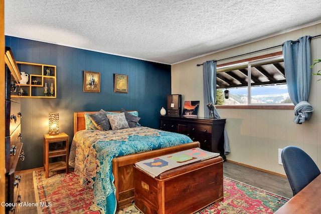 19856 B St Joe River Rd, Calder, ID 83808 - bedroom with baseboards, a textured ceiling, and wood finished floors
