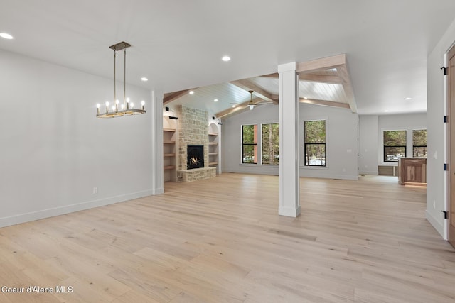 unfurnished living room featuring recessed lighting, a stone fireplace, vaulted ceiling with beams, and light wood-type flooring