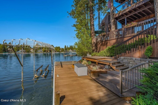 view of dock featuring a water view and stairway