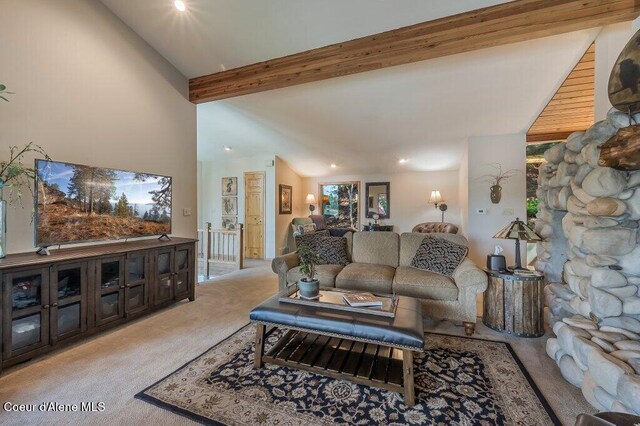 living room with lofted ceiling with beams, light carpet, and recessed lighting