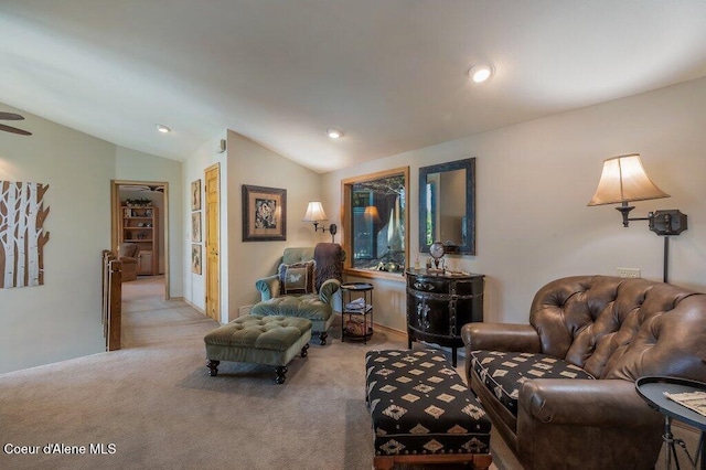 carpeted living area featuring vaulted ceiling and recessed lighting