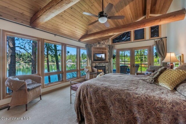 bedroom featuring a fireplace, light carpet, access to outside, wooden ceiling, and lofted ceiling with beams