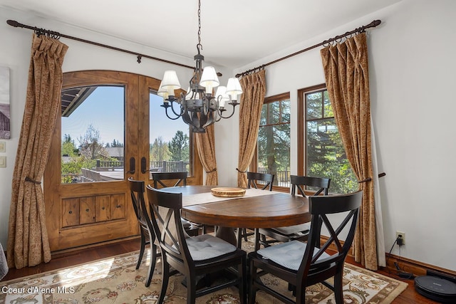 6012 W Quartzite Ln, Coeur Dalene, ID 83814 - dining space with a chandelier, wood finished floors, and french doors