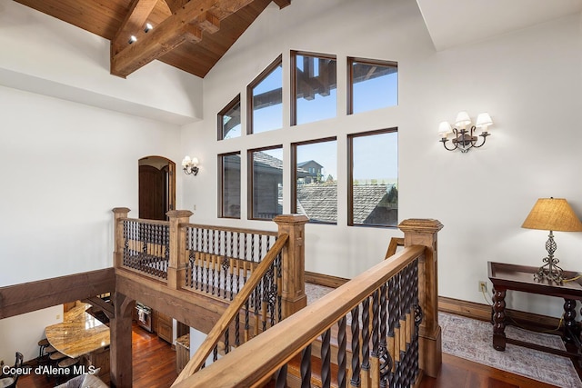 6012 W Quartzite Ln, Coeur Dalene, ID 83814 - hallway featuring an upstairs landing, wood finished floors, beam ceiling, high vaulted ceiling, and wood ceiling