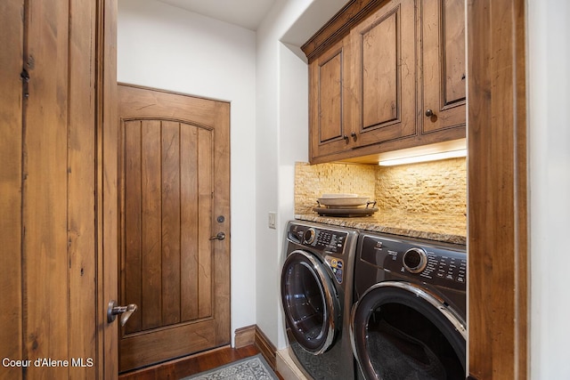 6012 W Quartzite Ln, Coeur Dalene, ID 83814 - laundry area with washer and clothes dryer, cabinet space, baseboards, and wood finished floors