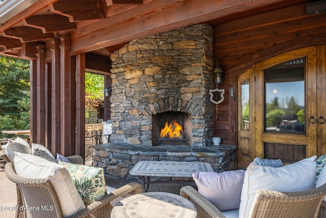 6012 W Quartzite Ln, Coeur Dalene, ID 83814 - view of patio / terrace with an outdoor living space with a fireplace