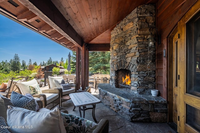 6012 W Quartzite Ln, Coeur Dalene, ID 83814 - view of patio with an outdoor living space with a fireplace
