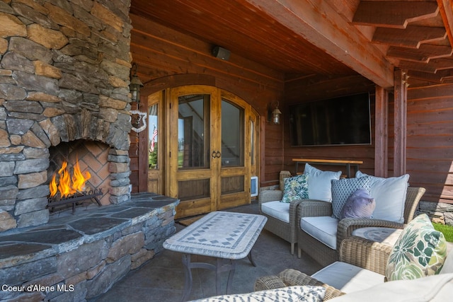 6012 W Quartzite Ln, Coeur Dalene, ID 83814 - view of patio with an outdoor stone fireplace