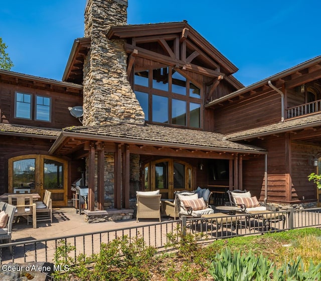 6012 W Quartzite Ln, Coeur Dalene, ID 83814 - rear view of property with a chimney, french doors, a patio, and fence