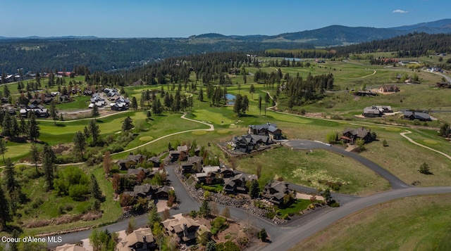 6012 W Quartzite Ln, Coeur Dalene, ID 83814 - aerial view of property and surrounding area featuring a forest, nearby suburban area, a water and mountain view, and a golf club