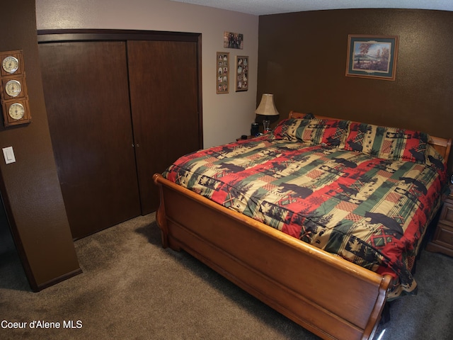 bedroom featuring a closet and carpet