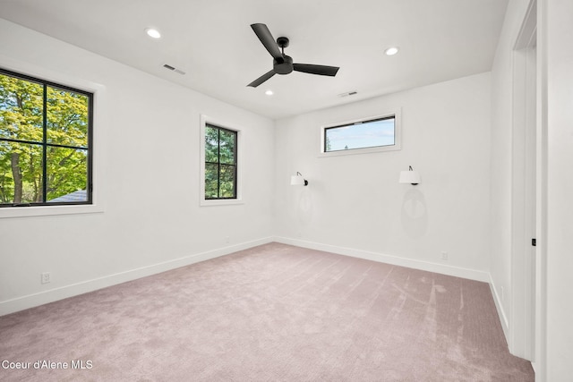 907 N B St, Coeur Dalene, ID 83814 - empty room featuring light colored carpet, baseboards, recessed lighting, and a ceiling fan