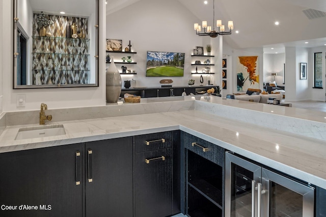 17056 S Lazurite Dr, Coeur Dalene, ID 83814 - bar with an inviting chandelier, a sink, vaulted ceiling, wine cooler, and visible vents