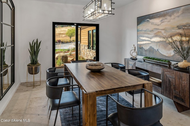 17056 S Lazurite Dr, Coeur Dalene, ID 83814 - dining area with baseboards and a notable chandelier