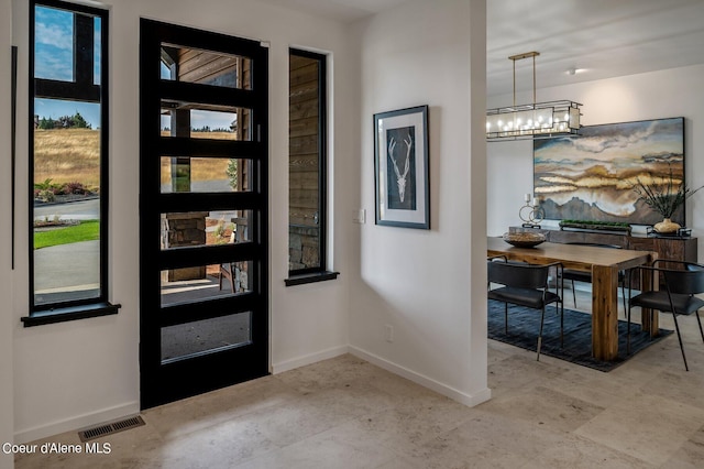 17056 S Lazurite Dr, Coeur Dalene, ID 83814 - entryway featuring an inviting chandelier, baseboards, plenty of natural light, and visible vents