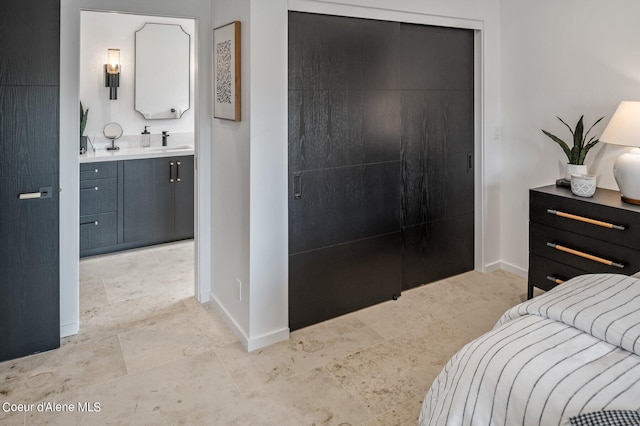 17056 S Lazurite Dr, Coeur Dalene, ID 83814 - bedroom with a sink, baseboards, ensuite bathroom, and a closet