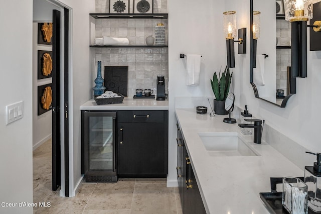 17056 S Lazurite Dr, Coeur Dalene, ID 83814 - bar featuring baseboards, wet bar, a sink, and wine cooler