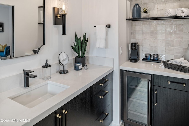 17056 S Lazurite Dr, Coeur Dalene, ID 83814 - bar with a sink, decorative backsplash, a bar, and beverage cooler