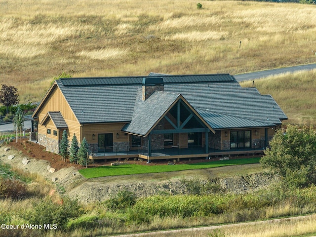 17056 S Lazurite Dr, Coeur Dalene, ID 83814 - exterior space featuring a chimney and stone siding
