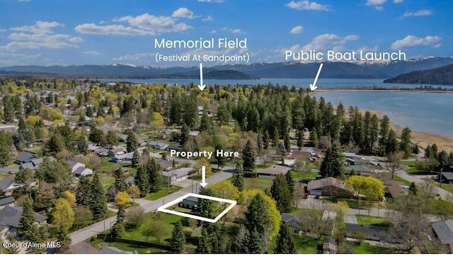 702 Merton Ave, Sandpoint, ID 83864 - aerial view of residential area with property boundaries highlighted and a water and mountain view