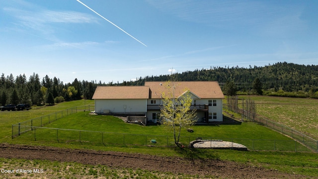 6035 W Conkling Rd, Worley, ID 83876 - exterior space featuring a fenced backyard, a wooded view, a rural view, and a front yard