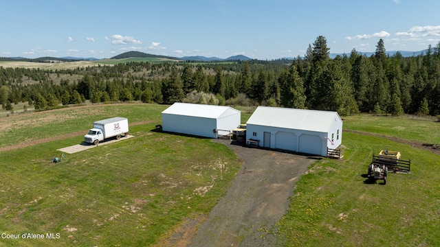 bird's eye view with a wooded view and a mountain view