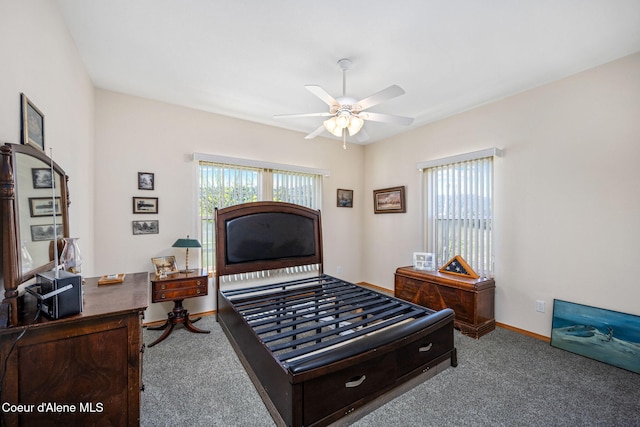 bedroom with baseboards and carpet