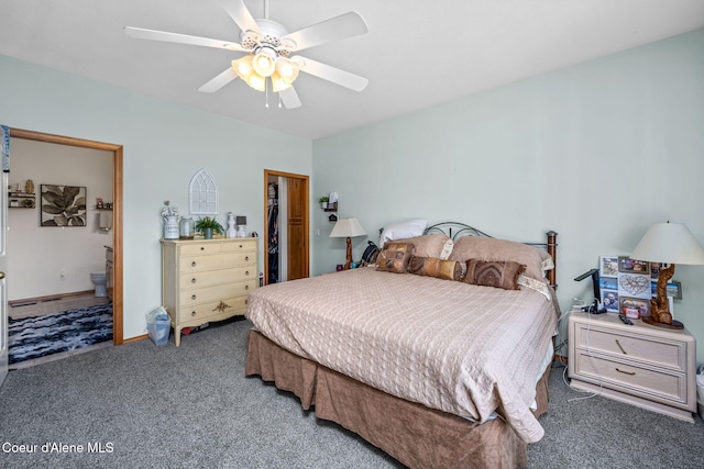 bedroom with connected bathroom, a ceiling fan, carpet, and a closet