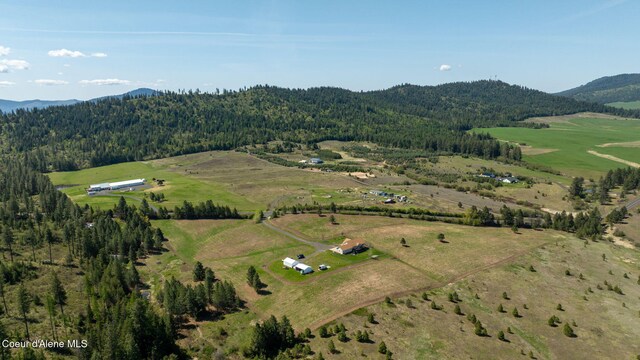 6035 W Conkling Rd, Worley, ID 83876 - drone / aerial view featuring a wooded view, a mountain view, and a rural view