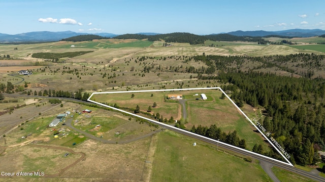 drone / aerial view featuring a rural view and a mountain view
