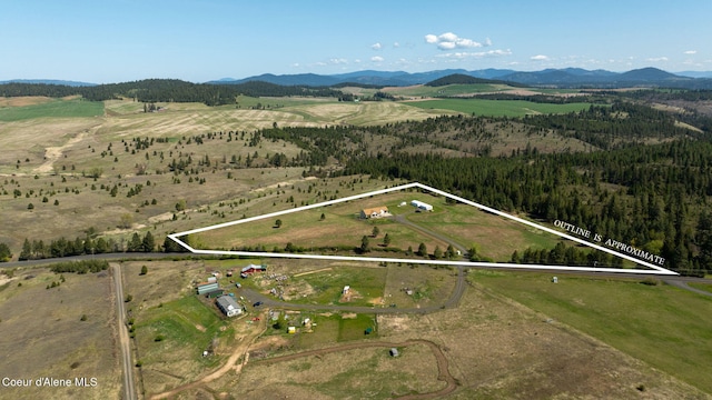 bird's eye view featuring a mountain view and a rural view