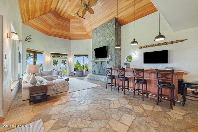735 S Bushwacker Rd, Coeur Dalene, ID 83814 - living area featuring a ceiling fan, high vaulted ceiling, wooden ceiling, and stone tile flooring